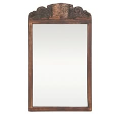 a mirror that is on top of a wooden frame with an ornate design in the middle