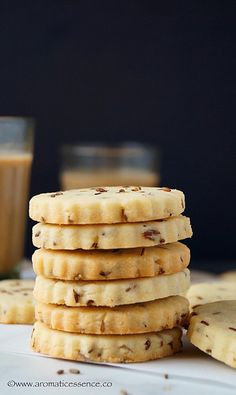 a stack of cookies next to a glass of milk