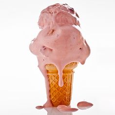 an ice cream sundae with pink icing on a white background stock photo getty images black bedroom furniture sets home design ideas