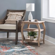 a chair and table in a room with blue walls