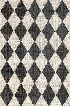 a black and white rug with diamonds on it