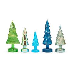 four glass christmas trees are lined up in a row on a white background, one is blue and the other is green