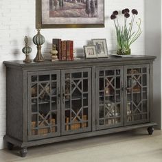 an old - fashioned sideboard with glass doors is displayed