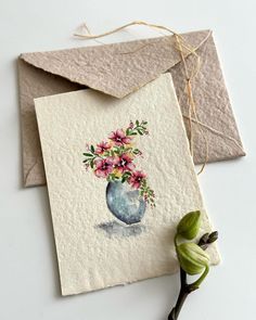 two cards with watercolor flowers on them