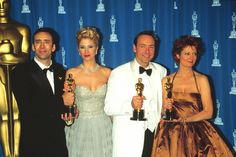 three men and two women posing with their oscars for the film's best actress