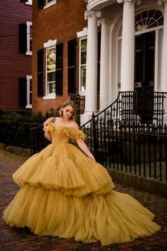 This yellow dream of a dress is such a statement piece with its tiered tulle skirt and off the shoulder, ruffled design. The color works well for all seasons and the full, voluminous skirt is simply a showstopper. This dress is extremely full, heavy and best suited to wear for a photoshoot where walking will be minimal or not required at all. Women's size 6 with a flexible (corset) back. Across the chest: 14.5 inches (corset back) Across the waist: 13 inches (corset back) Shoulder to hem: 56 inches in front, train in back Images: Taken at Camp Couture Salem Camp Couture, Outstanding Dresses, Yellow Princess Dress, Rent Costumes, Tiered Tulle Skirt, Voluminous Skirt, Couture Gowns, Princess Dress, All Seasons