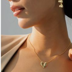 Discover the perfect blend of style and natural beauty with the Iris Love Heart Necklace. Handcrafted with 18K gold plating, this necklace is designed to make layering effortless and add a fashionable touch to any look. Enjoy the effortless beauty and simple luxury of this timeless piece. To keep your jewellery in the best condition, we recommend giving it a good care over time. By using a soft, lint-free jewellery cloth, you can remove blemishes that result from body oils, perfumes and lotions. Also remember try not to expose your jewellery in the open air. Our branded dusty bag or your jewellery box will keep them last longer. If you go to gym or spa, remember to take them off, because water or sweat will also damage them. Blemish Remover, Body Oil, Independent Designers Fashion, Free Jewelry, Heart Necklace, Timeless Pieces, Jewelry Box, 18k Gold, Gold Plate