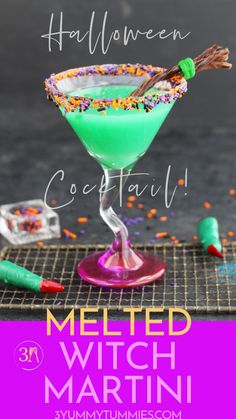 a halloween cocktail with sprinkles on the rim