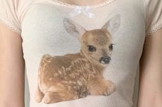 a women's t - shirt with an image of a baby deer on it