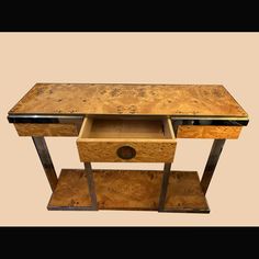 a wooden table with two drawers on each side and an open drawer in the middle