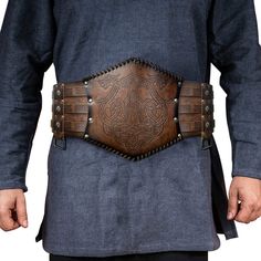 PRICES MAY VARY. 🌳 COOL DESIGN- Unique viking style wide belt, for the true viking warriors. Vintage buckles with embossed traditional patterns, bring you back to the viking age. Are you ready to unleash your rage?! 🌳 HIGH GRADE FAUX LEATHER-Looks like Genuine leather, feels like genuine leather but no animals harmed.We love animals and all the living kinds! 3mm thickness, tough hand feelings. 🌳 ADJUSTABLE-One size for all. Suitable for most of the body shapes(waist length 97cm/38.2inch-132cm Viking Warriors, Viking Belt, Costume Armour, Medieval Belt, Warrior Costume, Boho Festival Fashion, Larp Costume, Leather Armor, Wide Leather Belt