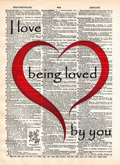 the words i love being loved by you written on an old book page with a red heart