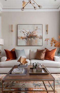 a living room filled with lots of furniture next to a large painting on the wall