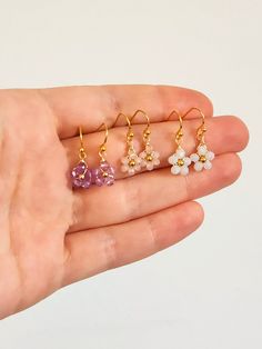 Crystal Daisy Dangle Earrings Inspired by dainty daisies, these cute dangle earrings are the perfect addition to your look. Ideal for those who love a floral design and drop style earrings. Makes for a lovely custom gift or a present for yourself! DETAILS Materials: Glass crystals, Gold color wire and beads If you have any questions send me a message so we can chat! 🥰 Dangle Crystal Earrings With Flower Charm As Gift, Delicate Flower Charm Earrings, Delicate Nickel-free Dangle Flower Earrings, Flower Shaped Crystal Earrings With Flower Charm For Gifts, Flower Shaped Crystal Earrings With Flower Charm, Flower-shaped Crystal Earrings With Flower Charm As Gift, Flower-shaped Crystal Earrings With Flower Charm, Flower Shaped Crystal Earrings For Gift, Flower-shaped Crystal Earrings For Gift