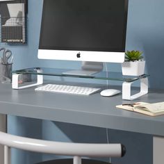 an apple computer sitting on top of a desk