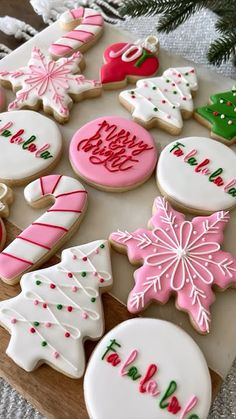 decorated christmas cookies on a cutting board