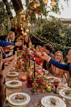 a group of people sitting around a dinner table