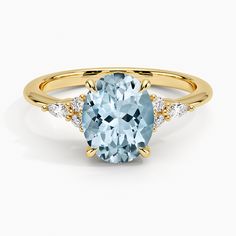 Aquamarine Nadia Diamond Engagement Ring - 18K Yellow Gold. This elegant ring features a dazzling cluster of round and marquise-shaped diamonds that rest upon the shoulders of the gently tapered band. The center gem is held by four claw prongs as it sits upon a slightly open gallery (1/10 total carat weight). Pear Diamond Engagement Ring, Pear Diamond Rings, Three Stone Diamond Rings Engagement, Three Stone Diamond Ring, Aquamarine Engagement Ring, Three Stone Diamond, Pear Diamond, Pear Shaped Diamond, Elegant Ring