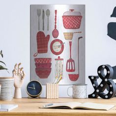 a wooden table topped with lots of different types of kitchen utensils and decor