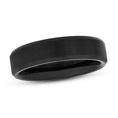 a black wedding band is shown on a white background with the center ring in polished and matte