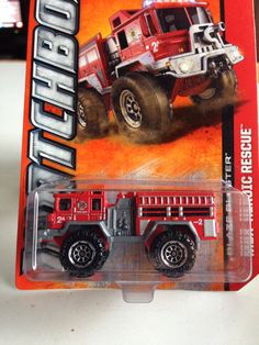 a red toy truck is in the package