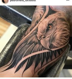 a man's arm with a lion tattoo on it, and an eagle in the middle