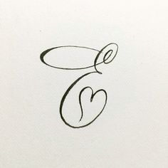 the letter e is inscribed in cursive writing with a heart on it's side