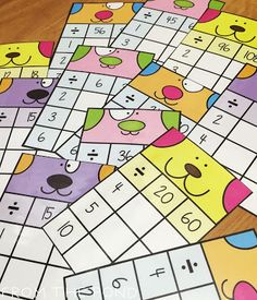 several dog themed sud puzzles on a wooden table