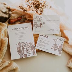 some papers are sitting on top of a table with rocks and other items around them