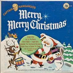 an old christmas album with santa claus and reindeers on it's cover,