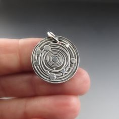 "Solar System Necklace - Sterling Silver, Planet Necklace, Universe Necklace, Space Charm, Adventure Jewelry, Cosmos, Graduation Gift, Astronomer \"And, when you want something, ALL the Universe conspires in helping you achieve it.\" The Alchemist Follow your dreams, love your truth. Do what brings joy to your heart and soul...for it knows the way. This silver planetary charm is hand crafted from eco friendly recycled sterling silver. It hangs from your choice of sterling silver oxidized chains. Adventure Jewelry, Astronomy Necklace, Universe Necklace, Solar System Necklace, Space Necklace, Wax Seal Necklace, Galaxy Necklace, Planet Necklace, Space Jewelry