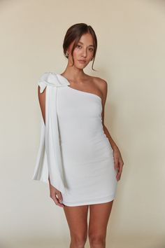 Mischa One Shoulder Bow Bodycon Mini Dress White Mini Dress Outfit Night, White Dress With Red Accessories, One Shoulder White Dress Short, Hoco Dresses With Bow, Graduation Dresses Winter, Short Grad Dress, White Dress With Bow, White Halter Dress Short, White Semi Formal Dress