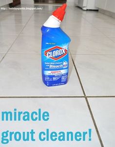 a bottle of clorox cleaner sitting on the floor next to a tiled floor