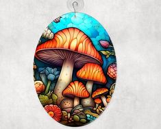 an oval stained glass window with mushrooms on it