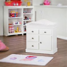 a white baby changing table in a play room