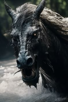 a close up of a horse in water with it's mouth open and hair blowing back