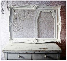 an old dresser with a mirror on it