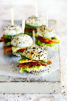 small sandwiches with bacon, lettuce and cheese