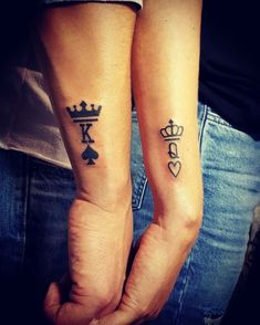 two people with matching tattoos on their arms