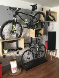 there is a bike mounted to the wall in this room with shelves on both sides