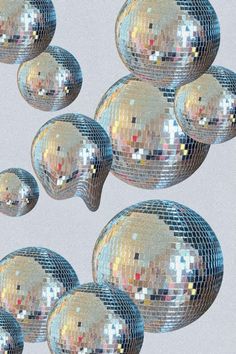 there are many shiny disco balls in the shape of an x - ray mirror on top of each other