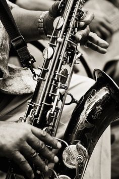 a close up of a person playing a saxophone