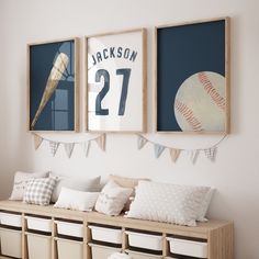 a baseball themed room with posters on the wall and storage bins underneath it,