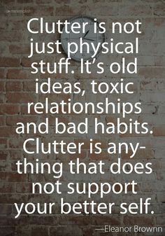 a brick wall with the words clutter is not just physical stuff