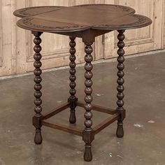 an old wooden table sitting in front of a door