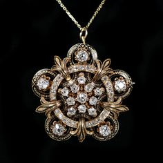 Victorian 18K yellow gold, Old Mine cut diamond (approx. 4.25 carat total weight, VS1/VS2 clarity, G/H color) and black enamel pendant/brooch. Evening Pendant Diamond Necklace With 17 Jewels, Ornate Gold Brooch With Rose Cut Diamonds, Fine Jewelry Diamond Large Pendant, Diamond Filigree Pendant Jewelry, Filigree Diamond Pendant Jewelry, Formal Pendant Brooch With Intricate Design, Ornate Gold Brooches With Rose Cut Diamonds, Luxury Yellow Gold Pendant Brooch, Luxury Gold Brooches With Rose Cut Diamonds