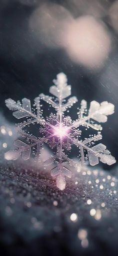 a snowflake that is on top of some kind of table cloth with water droplets