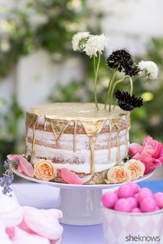 there is a cake with flowers on the table