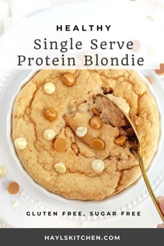 a close up of a plate of food with a spoon in it and text overlay that reads healthy single serve protein blondie