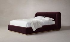 the bed is made up and ready for someone to use it in their home or office